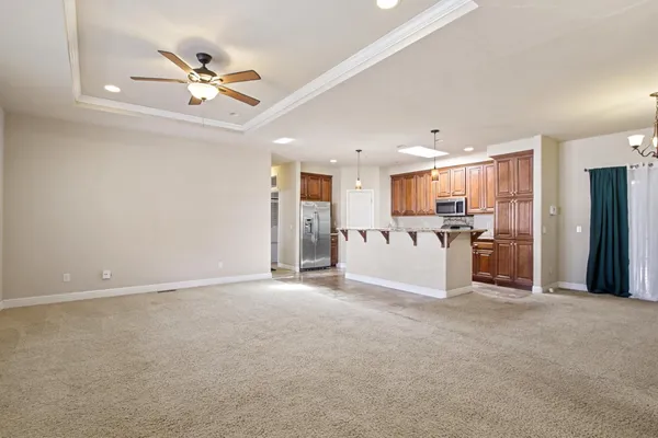 a view of a livingroom with a kitchen