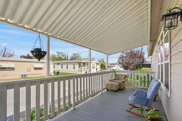 a view of a porch with furniture