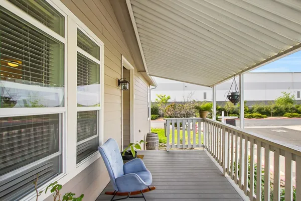 a view of a balcony with wooden floor