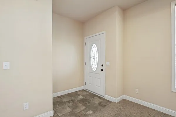 an empty room with mirror