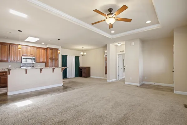 a view of a kitchen with a sink and cabinet