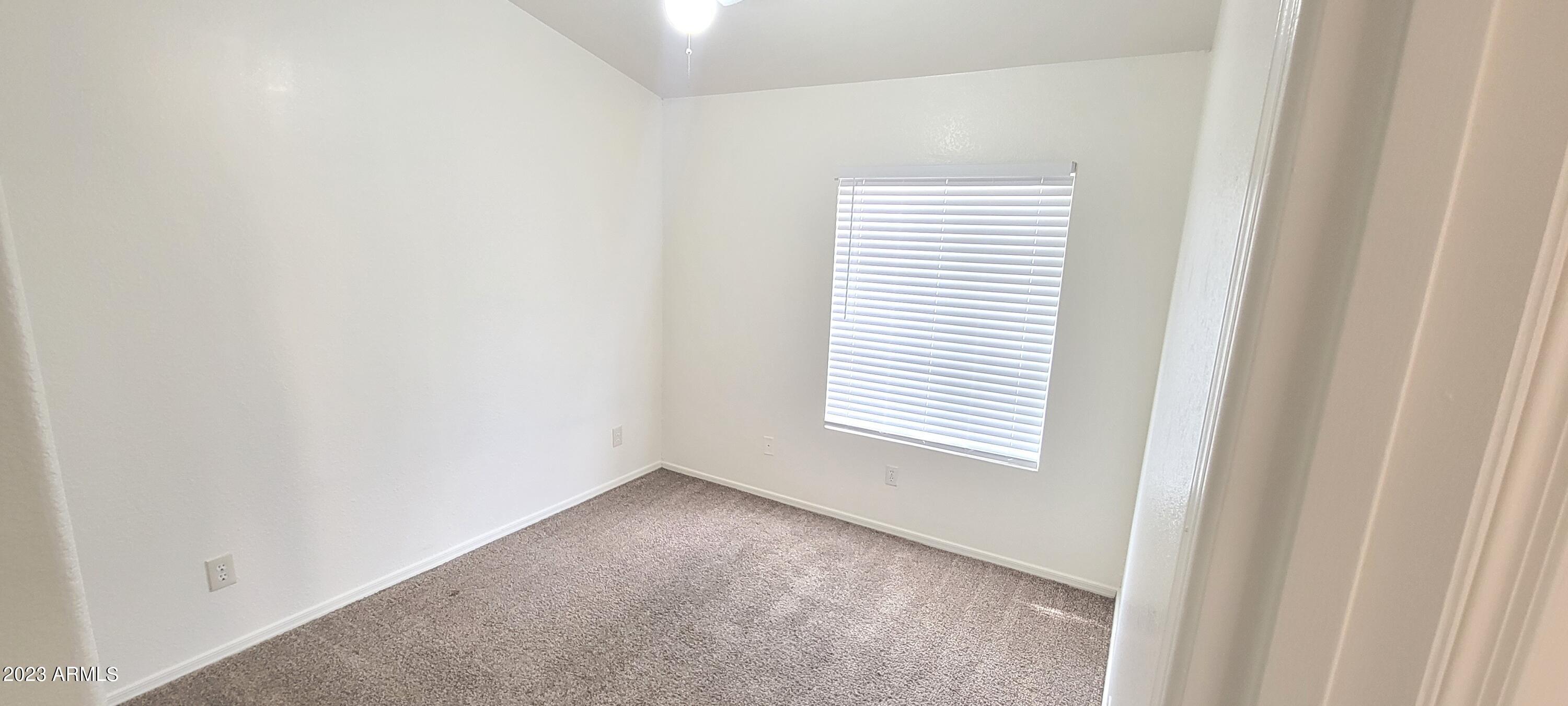 1202 North Bogle Avenue Chandler, AZ 85225 - Photo 11 of 16 a view of an empty room with a window