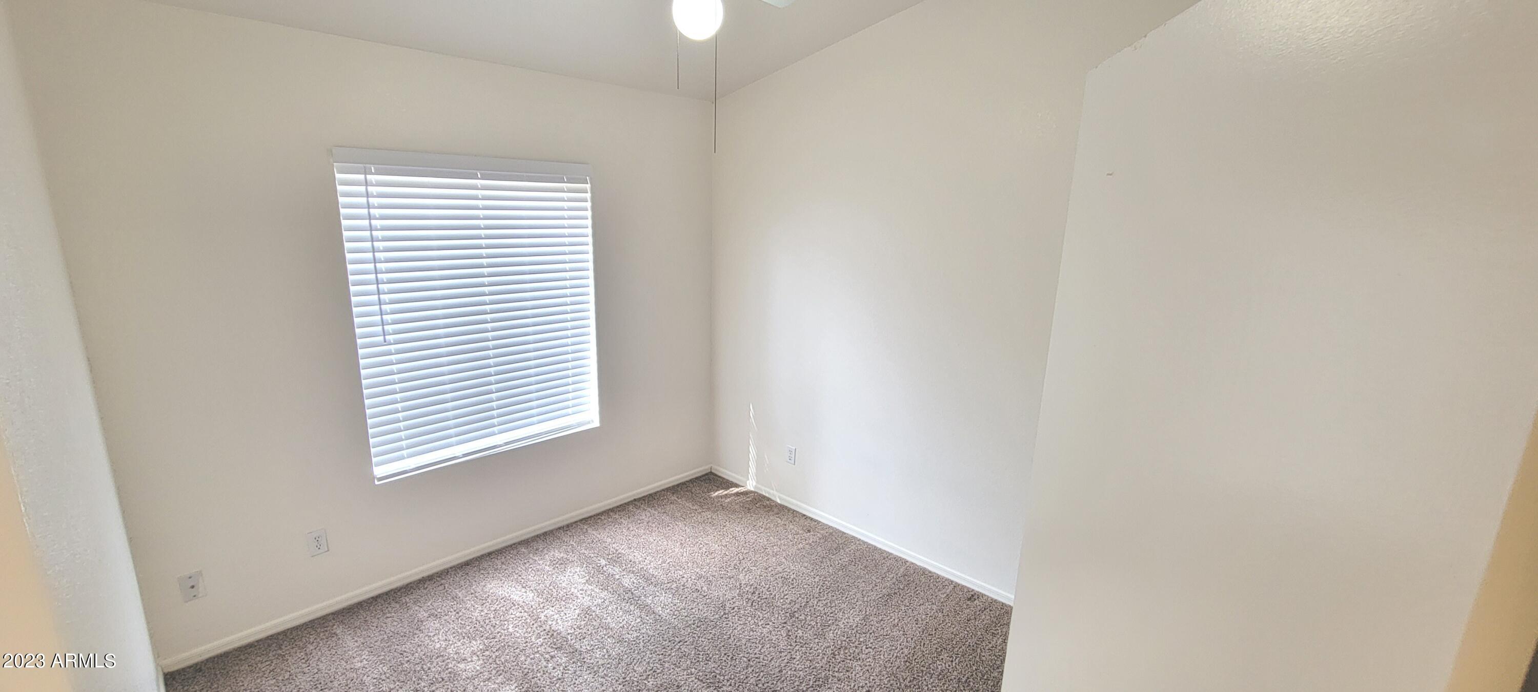 1202 North Bogle Avenue Chandler, AZ 85225 - Photo 12 of 16 an empty room with windows