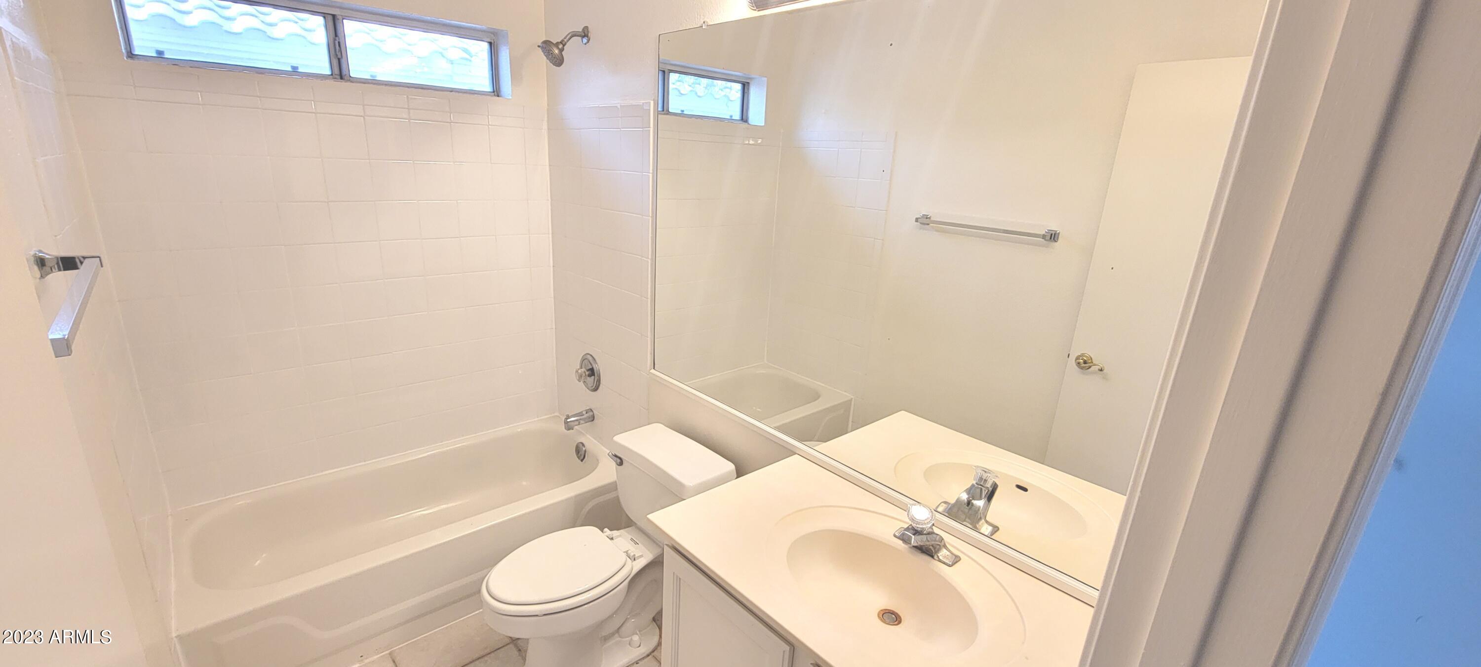 1202 North Bogle Avenue Chandler, AZ 85225 - Photo 13 of 16 a bathroom with a sink a toilet and shower