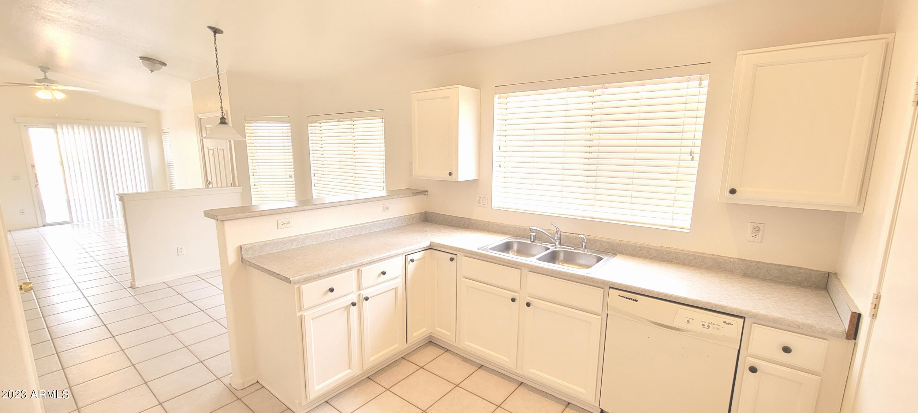 1202 North Bogle Avenue Chandler, AZ 85225 - Photo 7 of 16 a kitchen with a sink and cabinets
