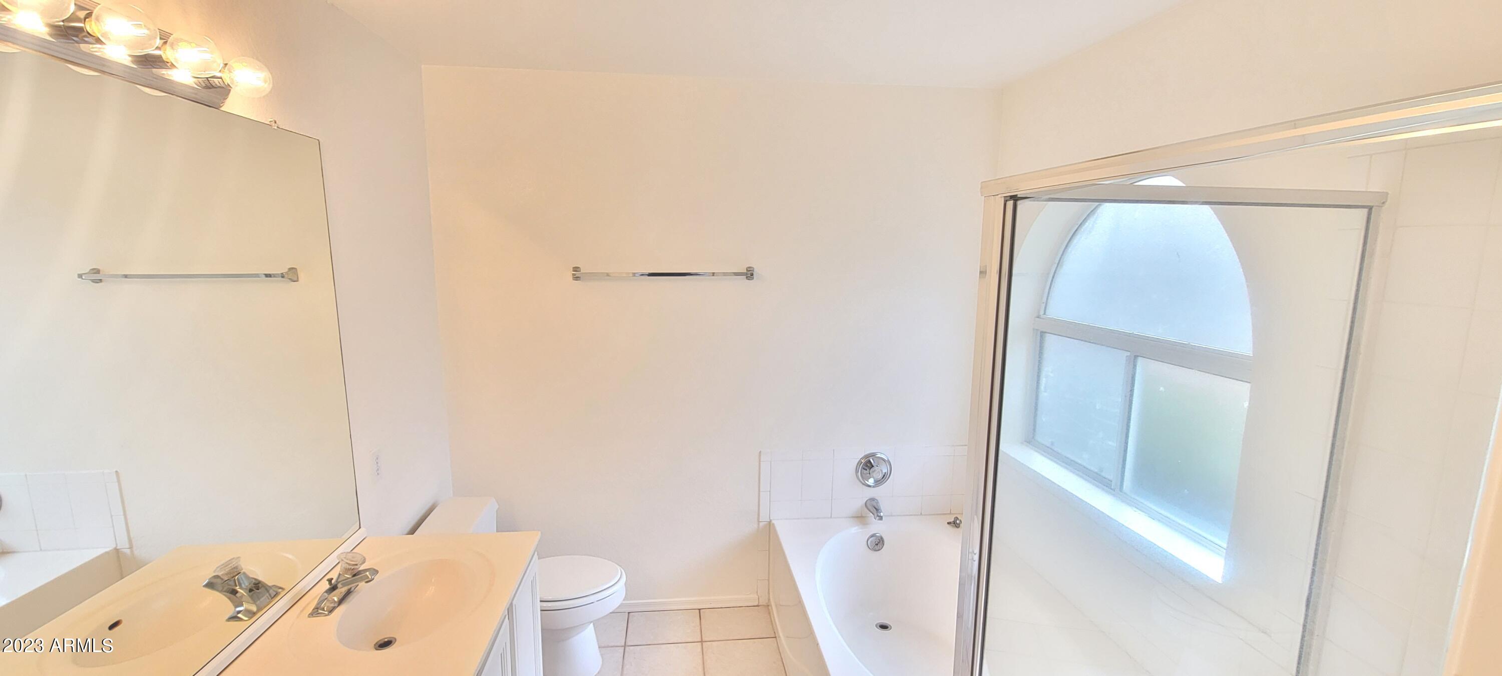 1202 North Bogle Avenue Chandler, AZ 85225 - Photo 10 of 16 a bathroom with a bathtub sink and toilet