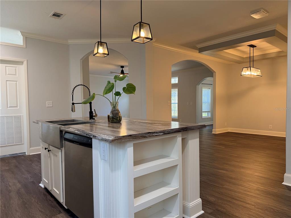 4440 Southwest 63rd Boulevard Gainesville, FL 32608 - Photo 19 of 49 a kitchen with a sink and chandelier