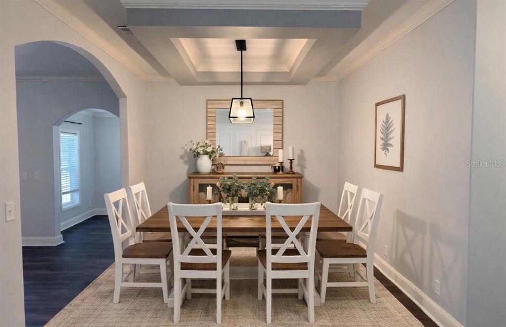 4440 Southwest 63rd Boulevard Gainesville, FL 32608 - Photo 20 of 49 a view of a dining room with furniture window and wooden floor