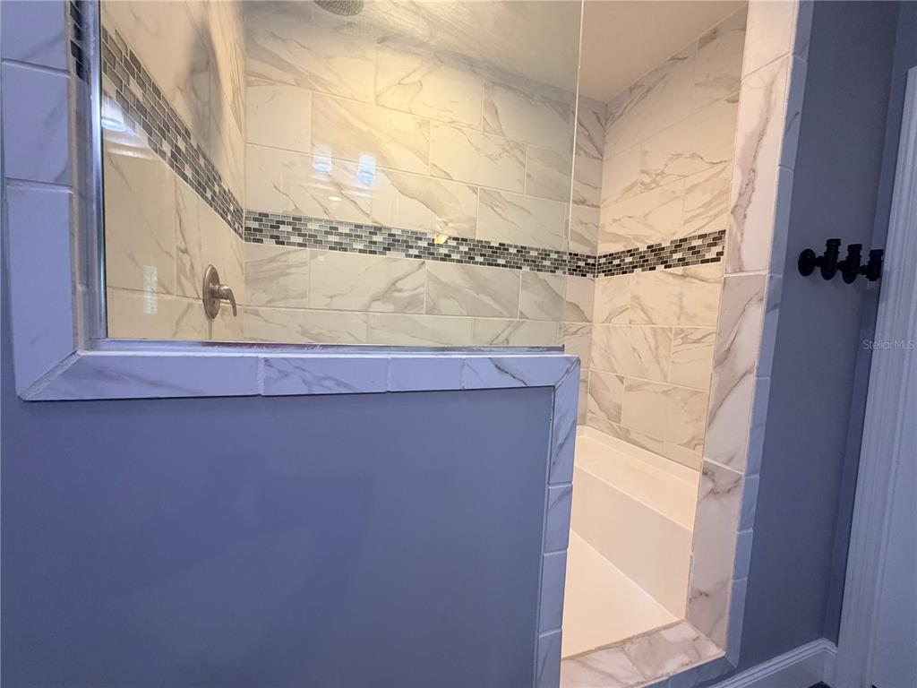4440 Southwest 63rd Boulevard Gainesville, FL 32608 - Photo 31 of 49 a bathroom with a shower and a window