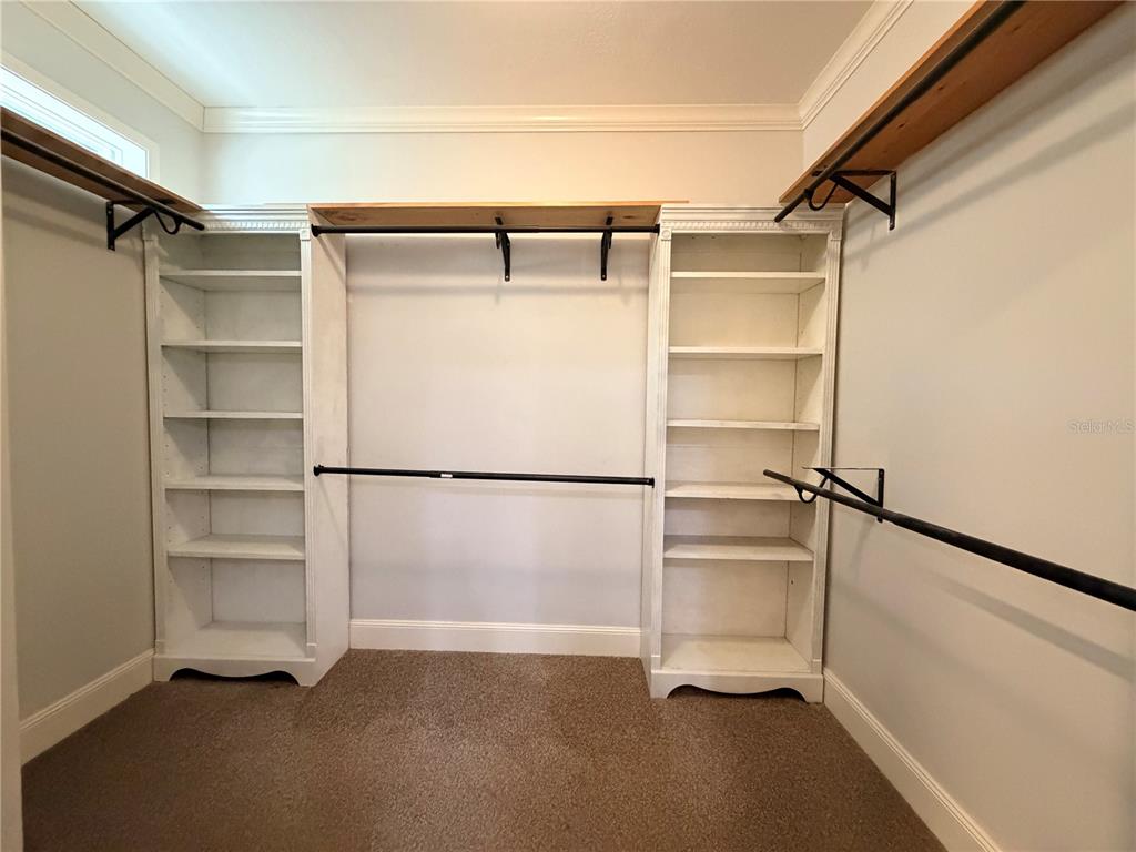 4440 Southwest 63rd Boulevard Gainesville, FL 32608 - Photo 33 of 49 a view of walk in closet with empty racks