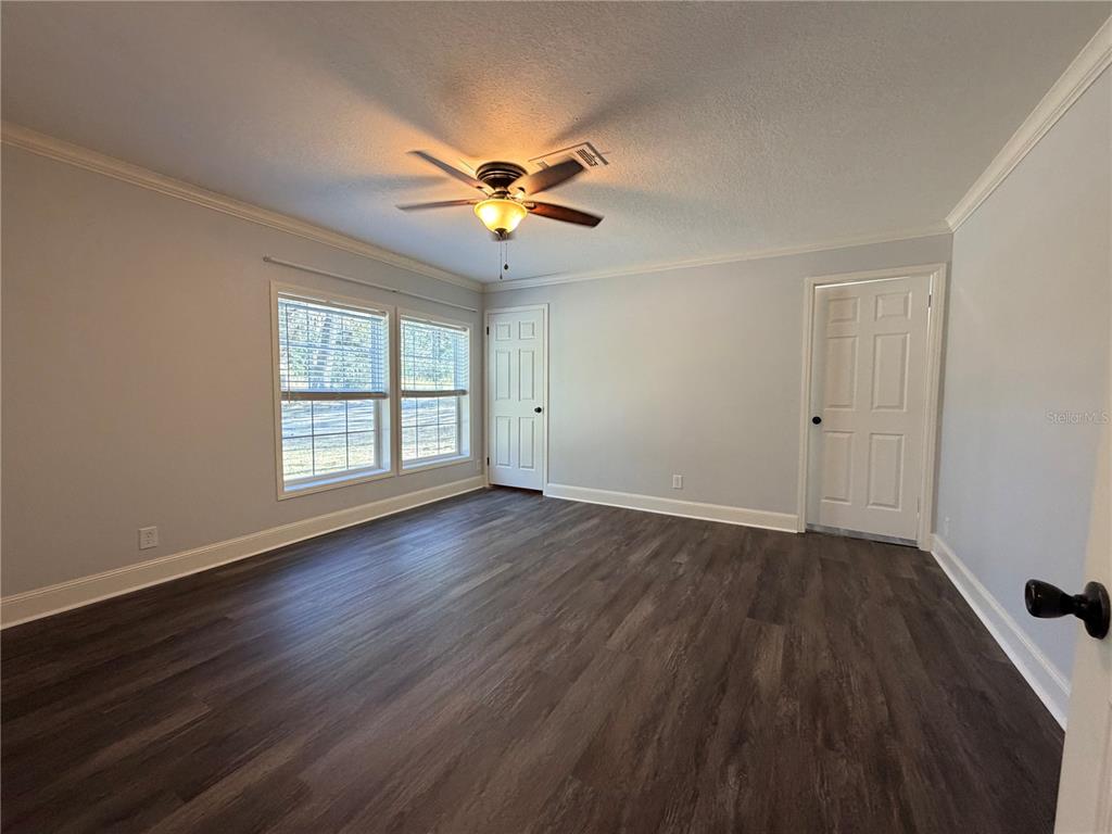 4440 Southwest 63rd Boulevard Gainesville, FL 32608 - Photo 35 of 49 wooden floor in an empty room with a window