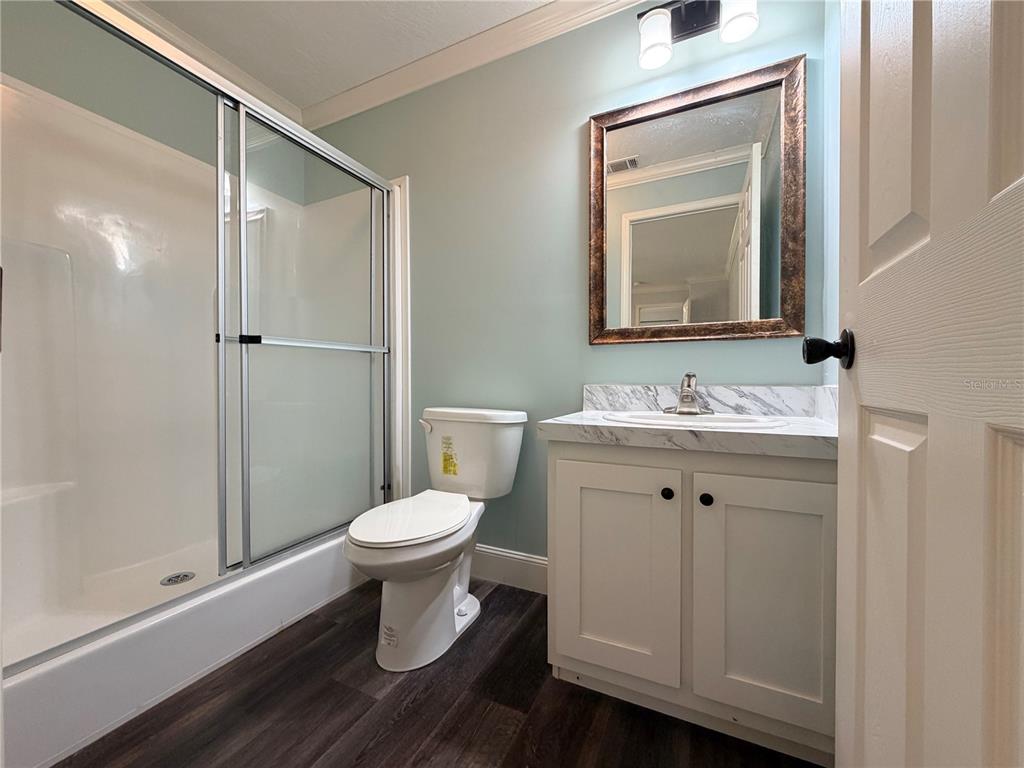4440 Southwest 63rd Boulevard Gainesville, FL 32608 - Photo 36 of 49 a bathroom with a toilet sink and a mirror