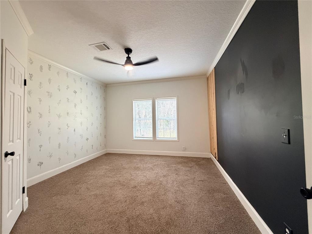 4440 Southwest 63rd Boulevard Gainesville, FL 32608 - Photo 38 of 49 a view of an empty room with a window