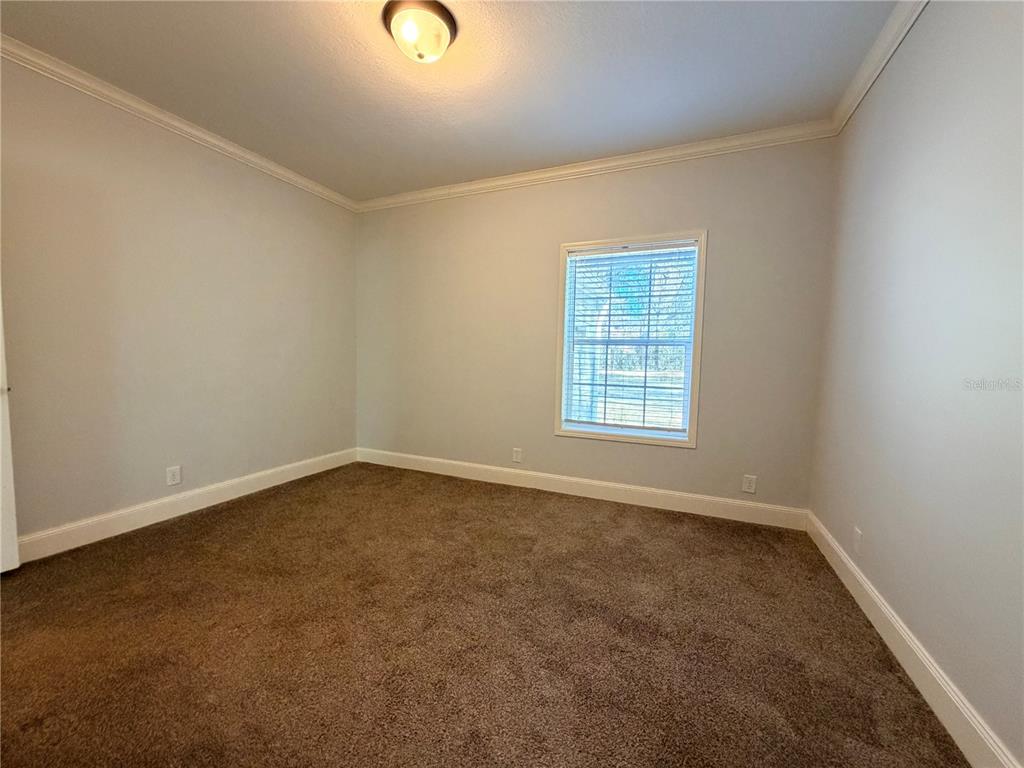 4440 Southwest 63rd Boulevard Gainesville, FL 32608 - Photo 40 of 49 an empty room with a window