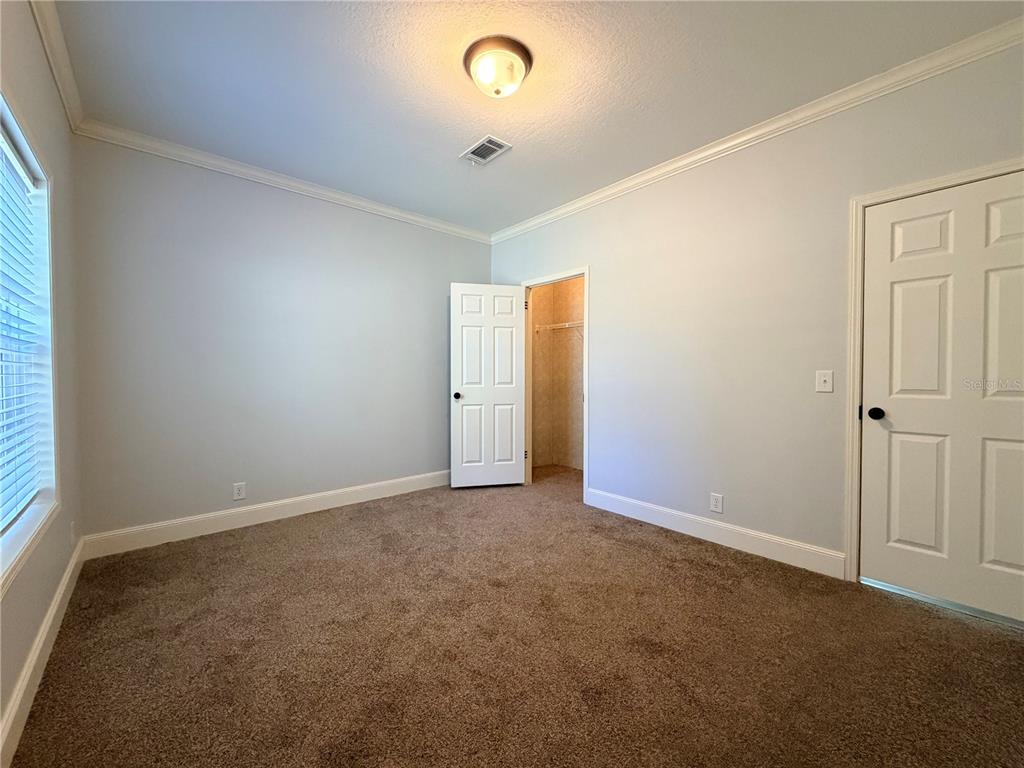 4440 Southwest 63rd Boulevard Gainesville, FL 32608 - Photo 41 of 49 an empty room with an entryway