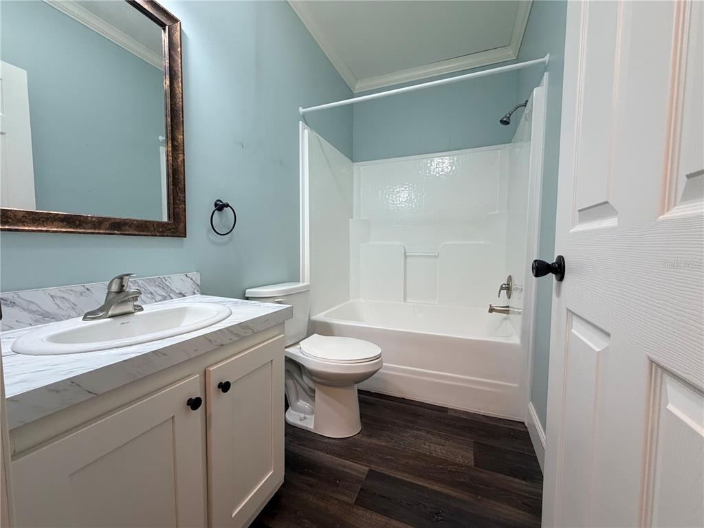 4440 Southwest 63rd Boulevard Gainesville, FL 32608 - Photo 42 of 49 a bathroom with a sink a toilet and shower
