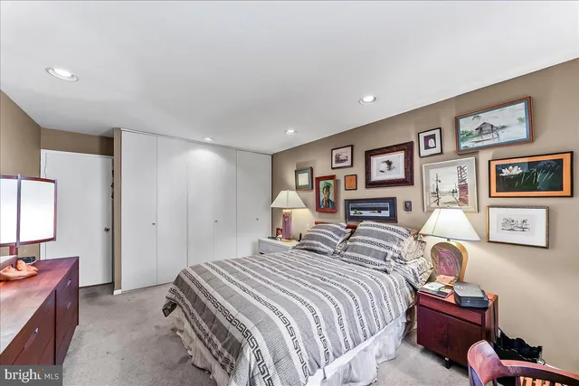 a bedroom with a bed and a lamp