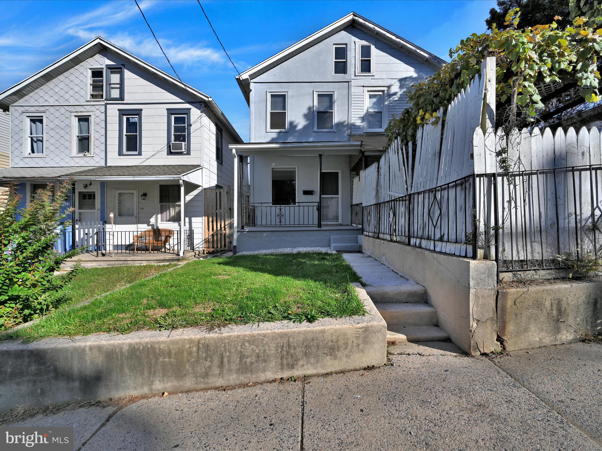 1253 Green Street Reading, PA 19604 - Photo 1 of 26 a front view of a house with a yard