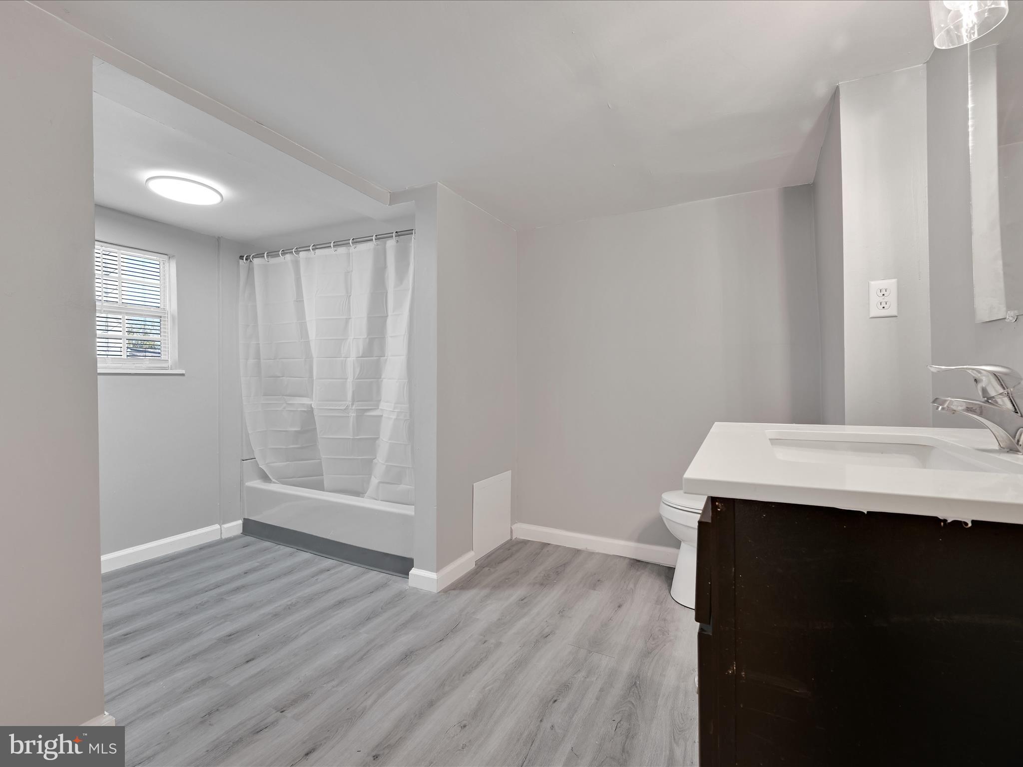 1253 Green Street Reading, PA 19604 - Photo 23 of 26 a bathroom with a sink a mirror and a shower
