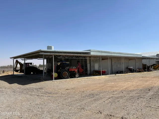 a view of a car park in front of a house