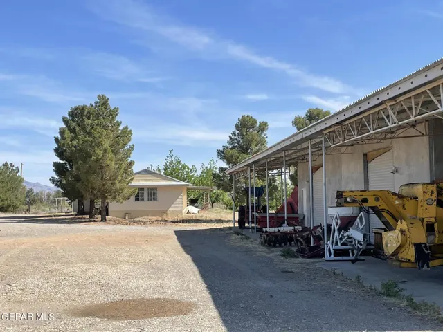 a pathway of a house with a yard