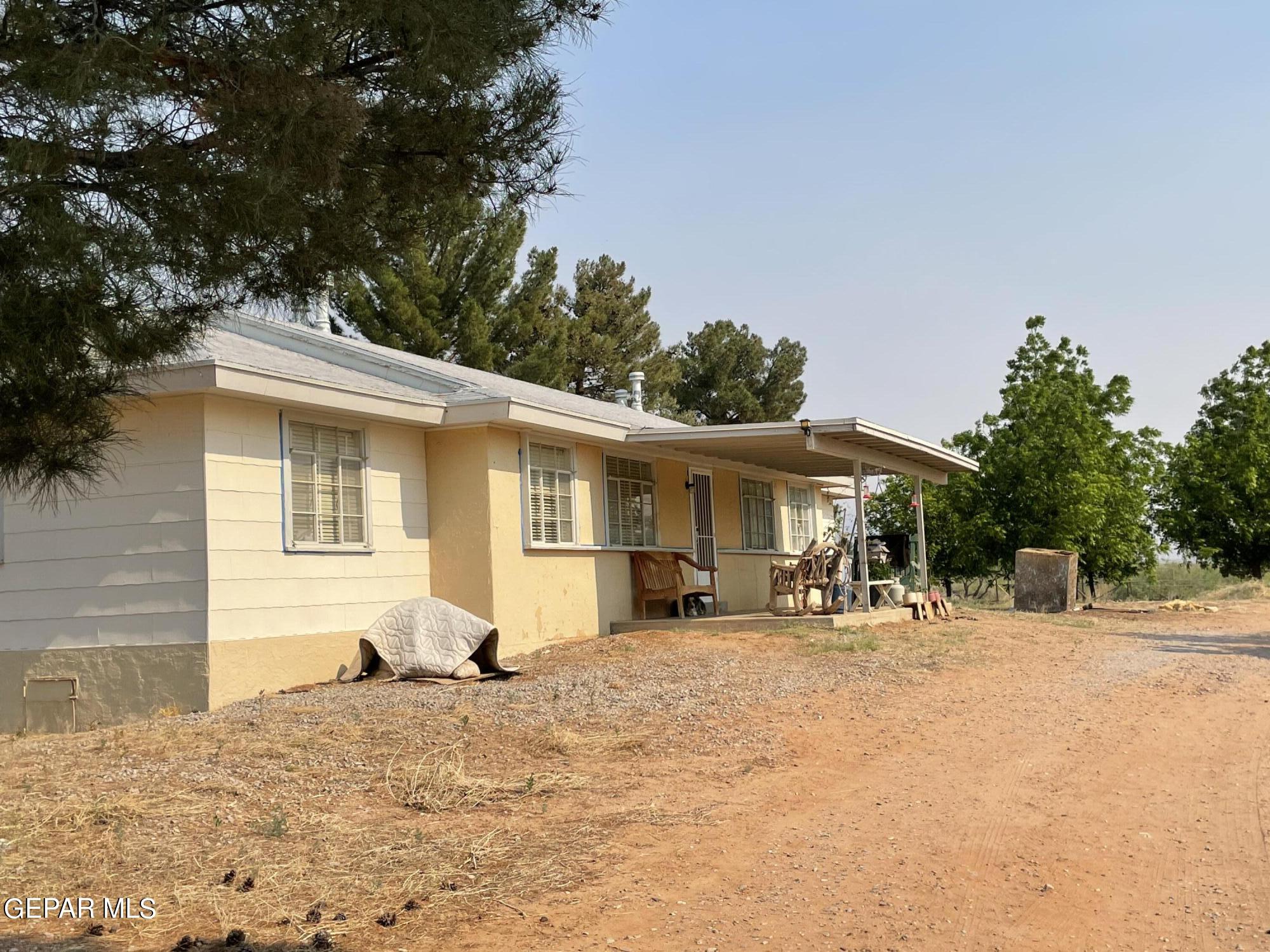 2695 Redstone Street Chaparral, NM 88081 - Photo 27 of 33 a front view of a house with a patio