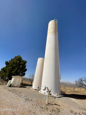 a view of a room with a bed and a window