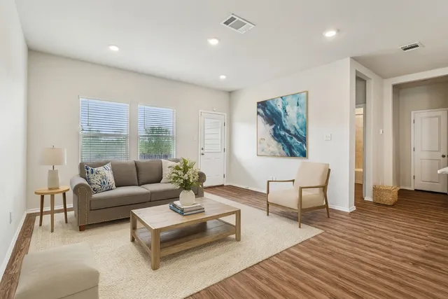 a living room with furniture and a large window