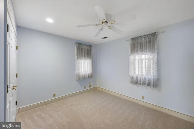 a view of a garage with rack and bicycle