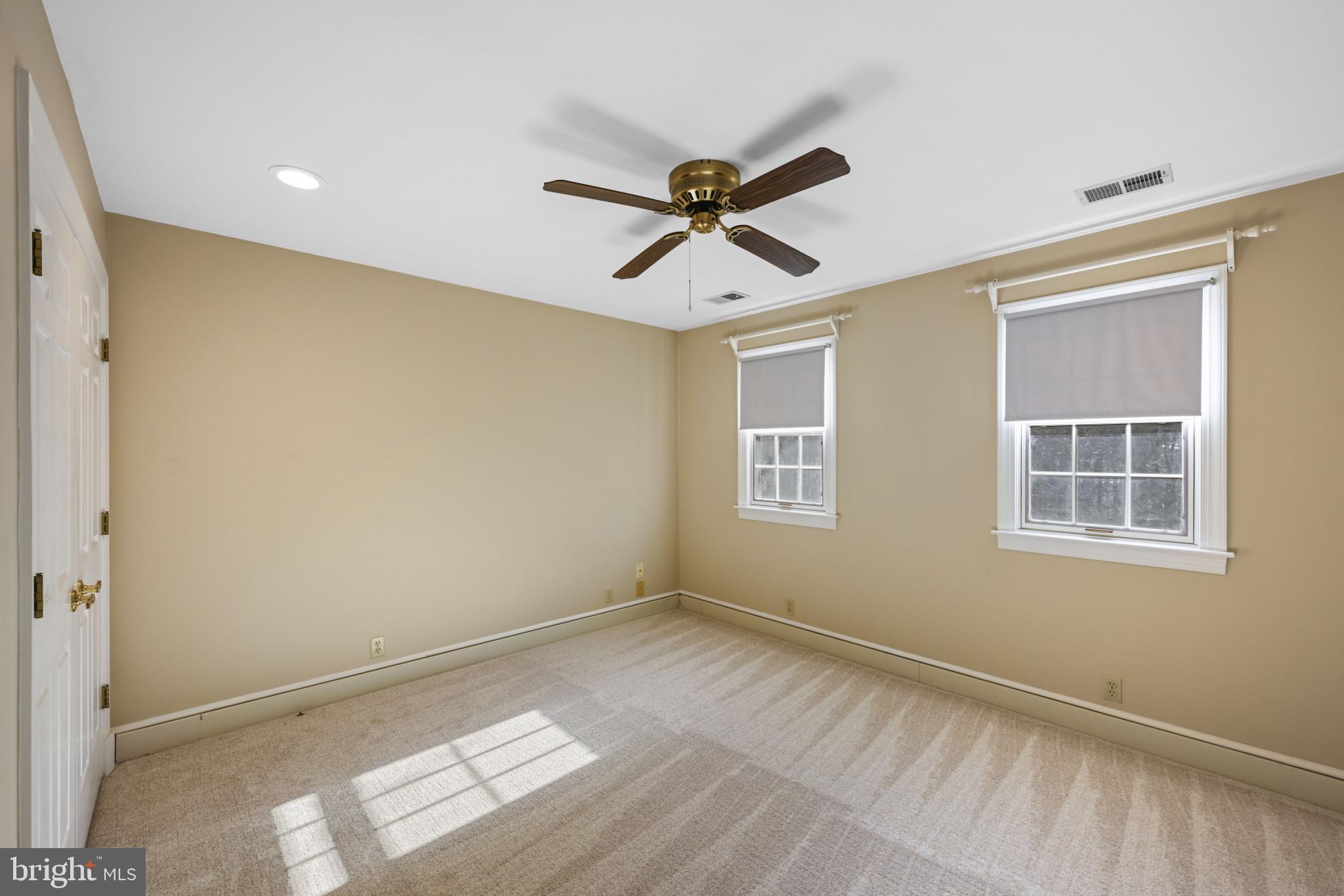 16966 Teagues Point Road Hughesville, MD 20637 - Photo 20 of 72 a view of empty room with window and ceiling fan