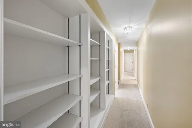 a bathroom with a sink mirror vanity and toilet