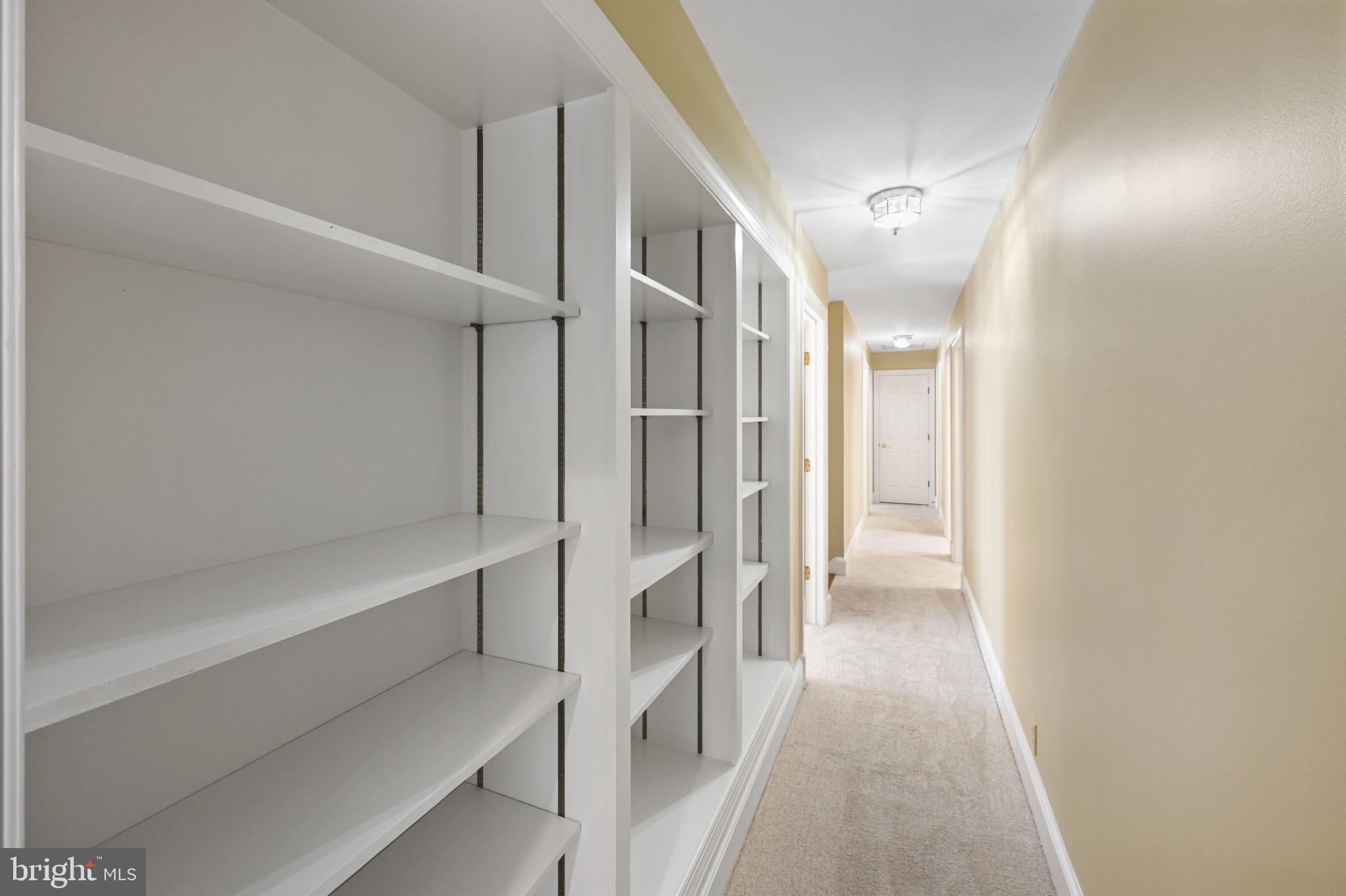 16966 Teagues Point Road Hughesville, MD 20637 - Photo 25 of 72 Corridor with light carpet and baseboards