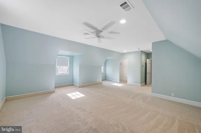 a backyard of a house with lots of green space and fountain