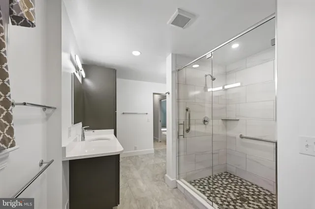 an aerial view of a house with a yard and large trees