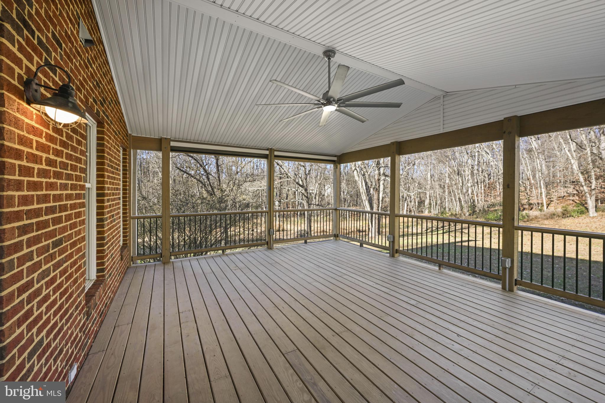 16966 Teagues Point Road Hughesville, MD 20637 - Photo 30 of 72 Wooden terrace with a ceiling fan