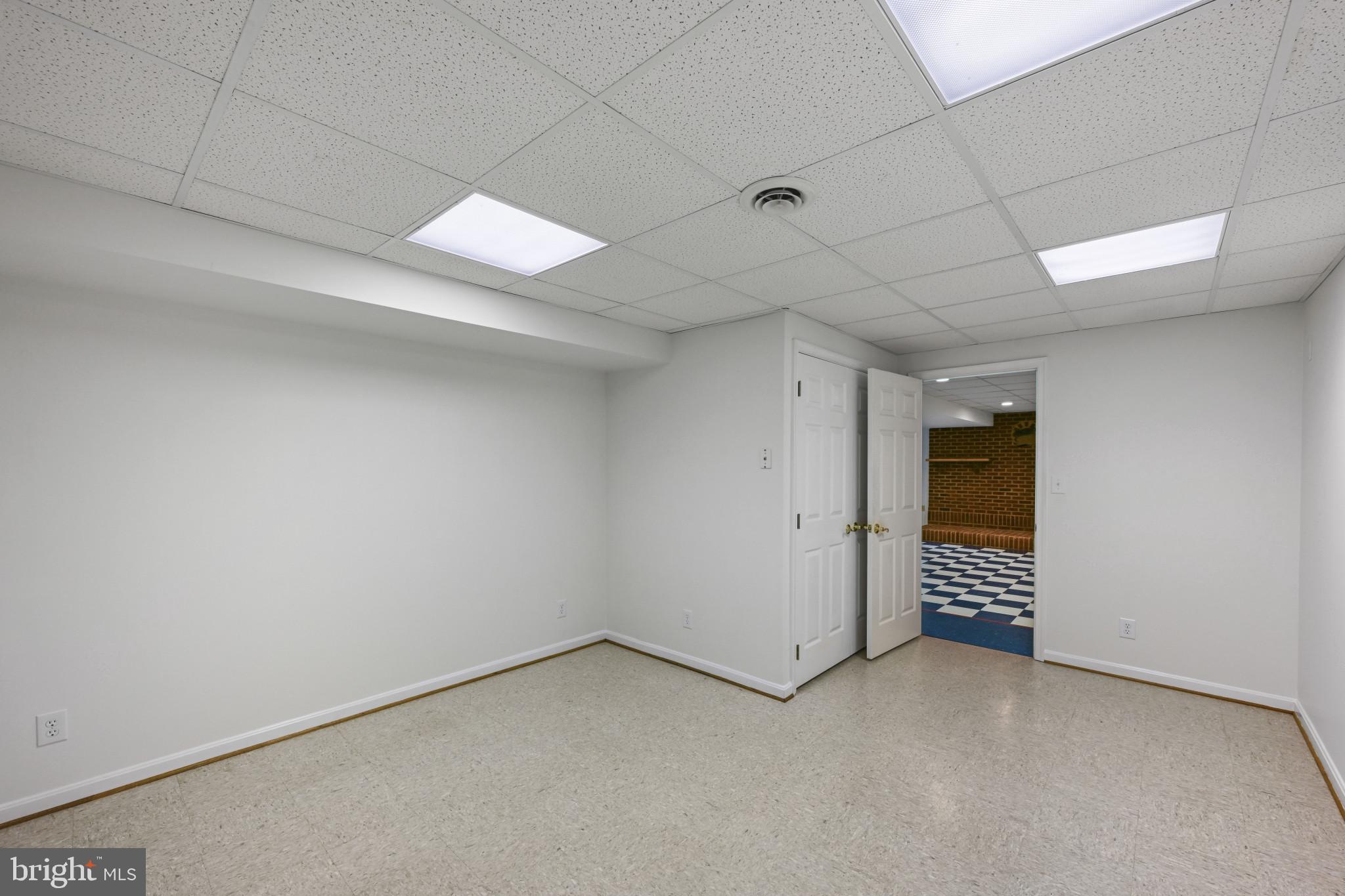 16966 Teagues Point Road Hughesville, MD 20637 - Photo 34 of 72 an empty room with a white walls and entryway