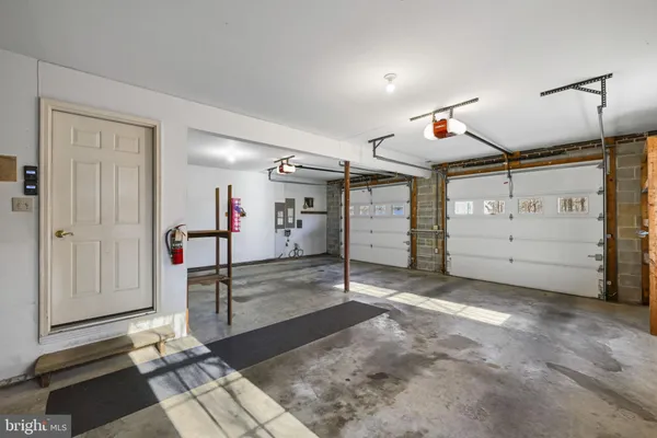 a view of parking garage with cars