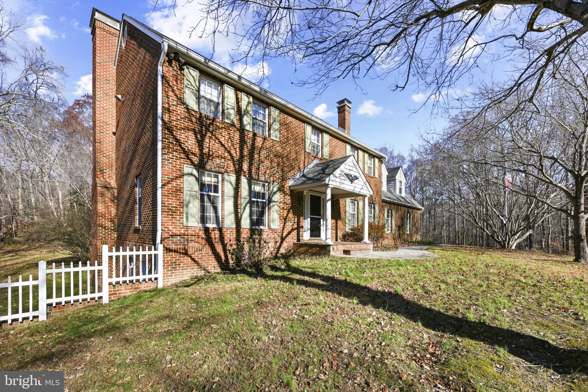 16966 Teagues Point Road Hughesville, MD 20637 - Photo 4 of 72 a front view of a house with a yard