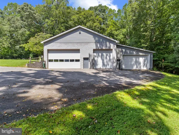 a bathroom with a sink mirror vanity and toilet