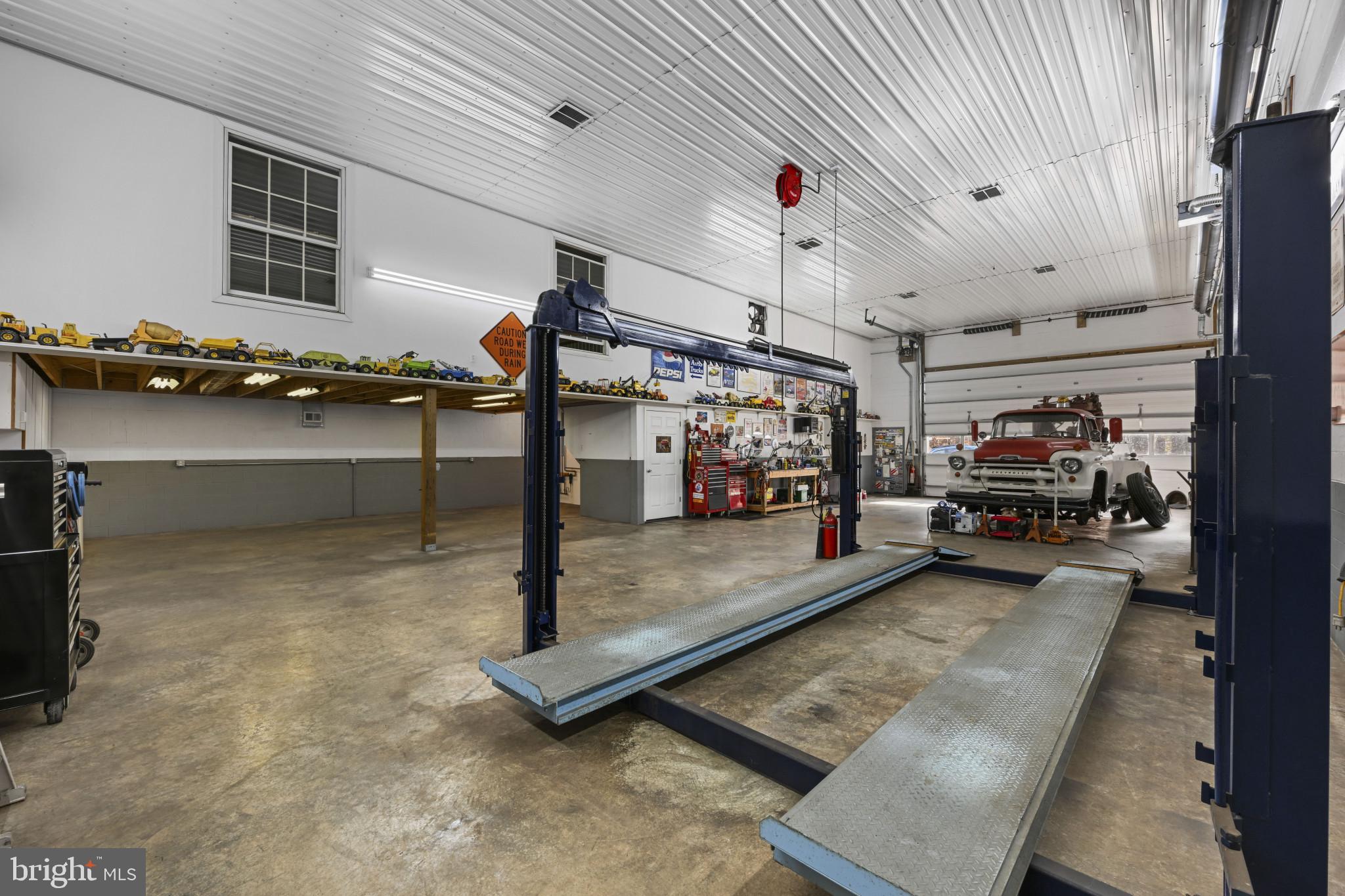 16966 Teagues Point Road Hughesville, MD 20637 - Photo 45 of 72 Garage featuring a workshop area