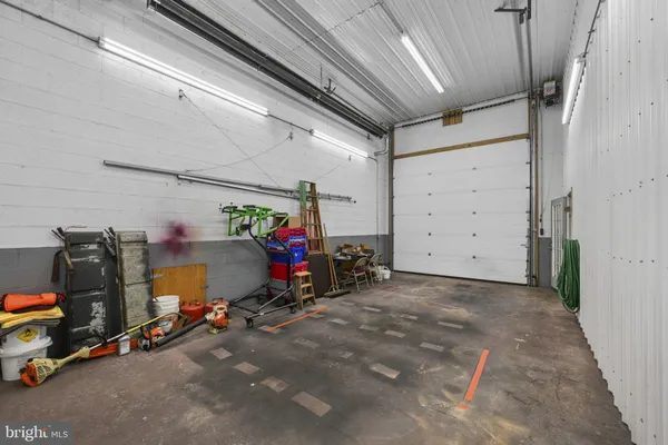 a backyard of a house with lots of green space and fountain