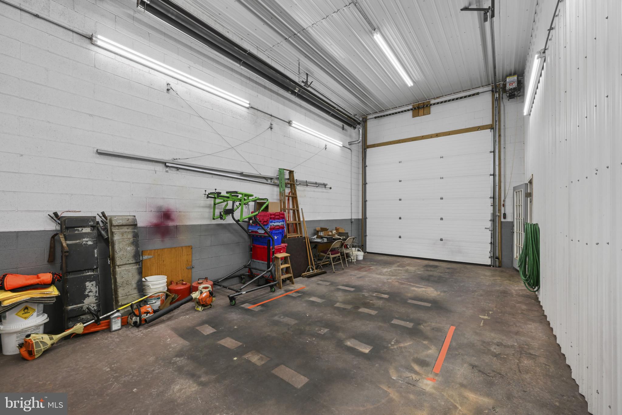 16966 Teagues Point Road Hughesville, MD 20637 - Photo 46 of 72 a view of a garage with rack and bicycle