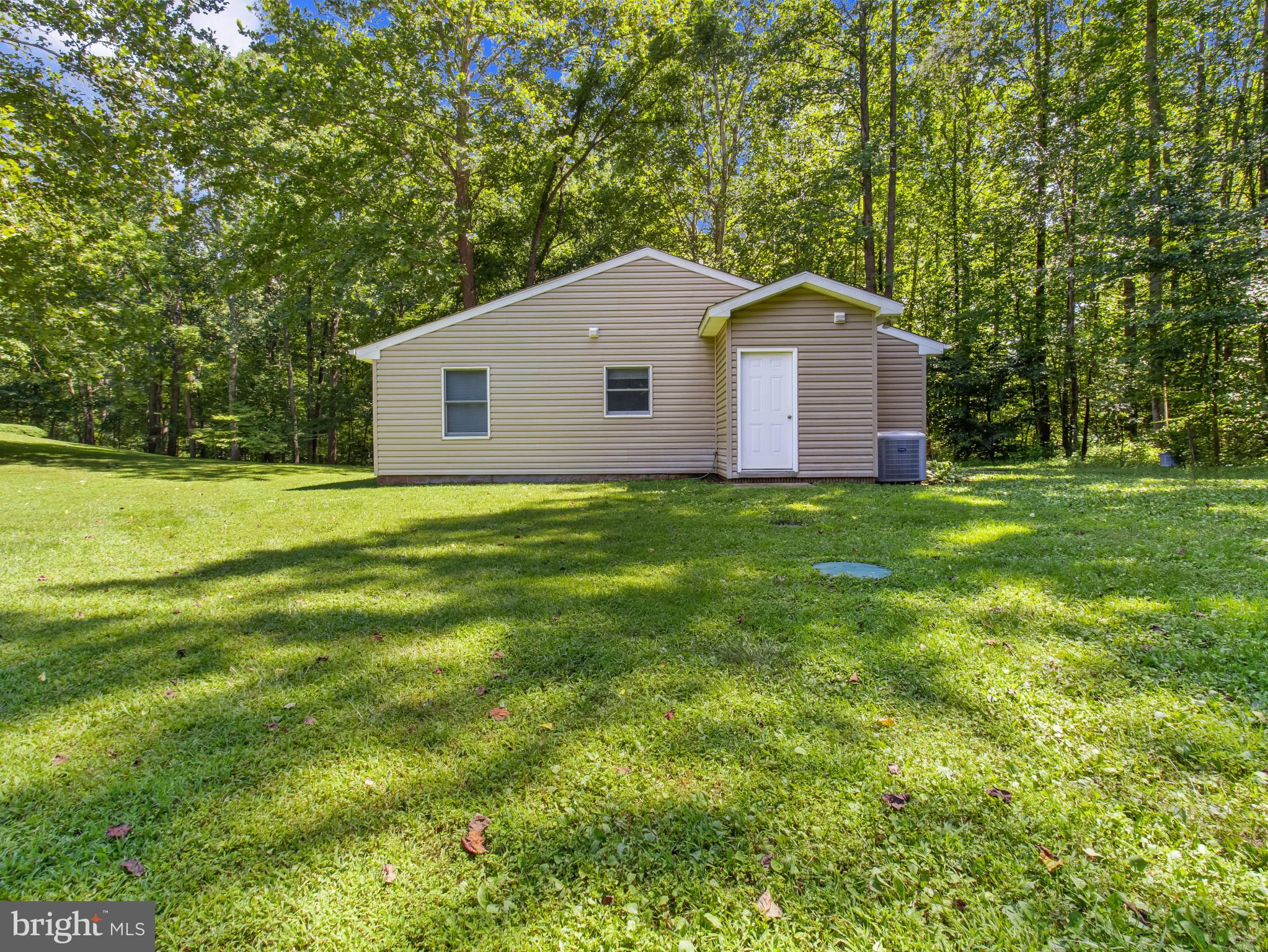 16966 Teagues Point Road Hughesville, MD 20637 - Photo 54 of 72 a house view with a outdoor space