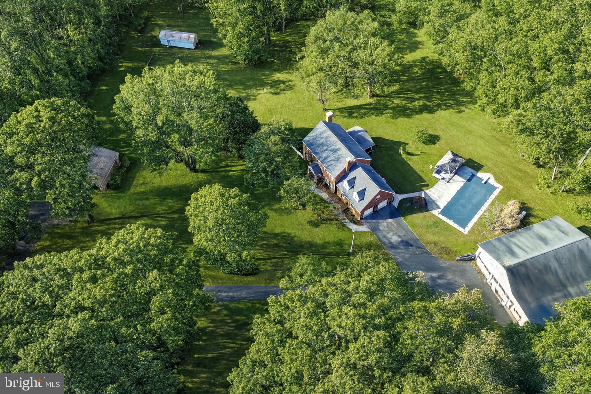 16966 Teagues Point Road Hughesville, MD 20637 - Photo 71 of 72 an aerial view of a house with outdoor space and street view