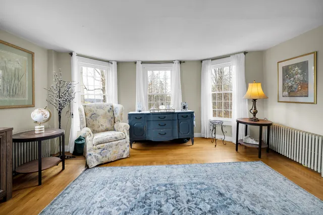 a living room with furniture and a table
