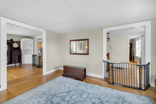 a view of a livingroom with furniture and an entryway