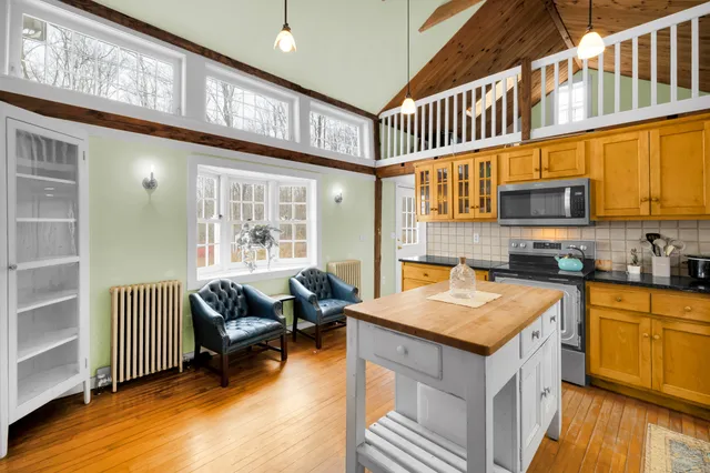 a kitchen with a sink cabinets and window