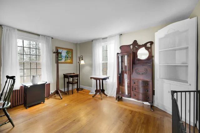 a livingroom with furniture wooden floor and a window