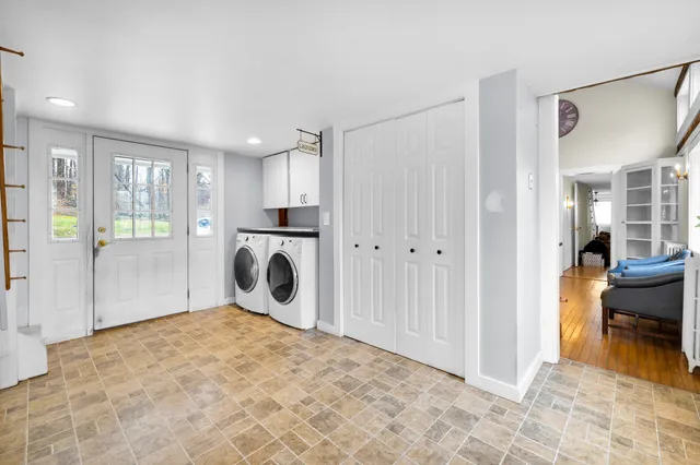 a view of a livingroom with a dishwasher and a refrigerator