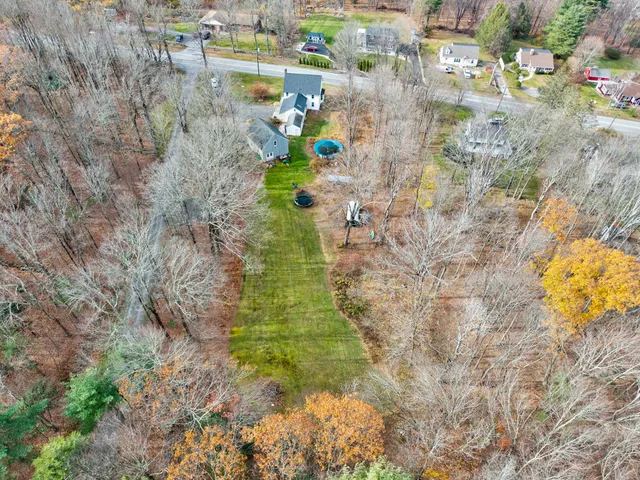 a aerial view of residential houses with outdoor space